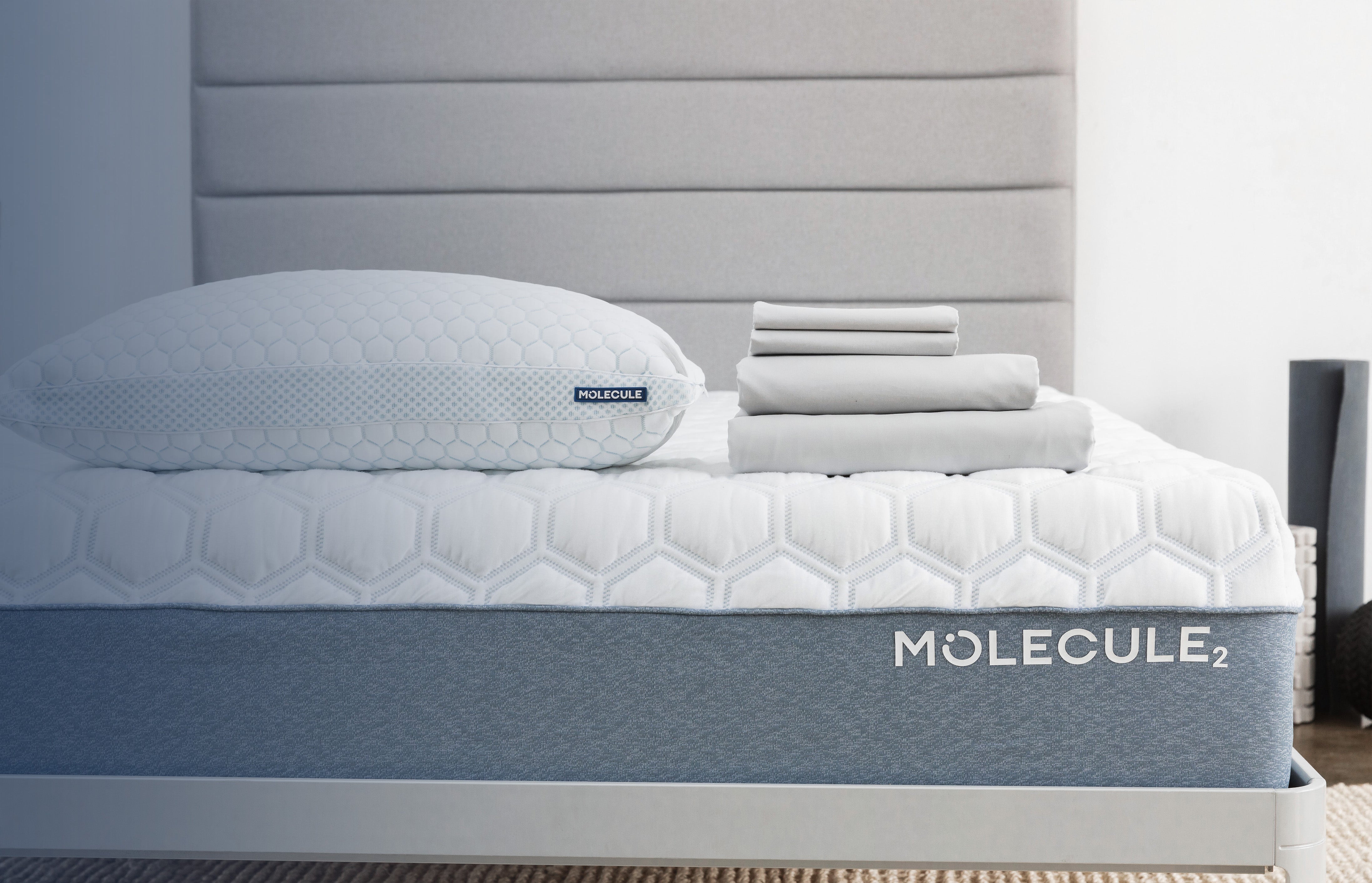 A Molecule Infinity Pro Adjustable Foam Pillow and sheet set resting on a Molecule 2 Airtec Mattress