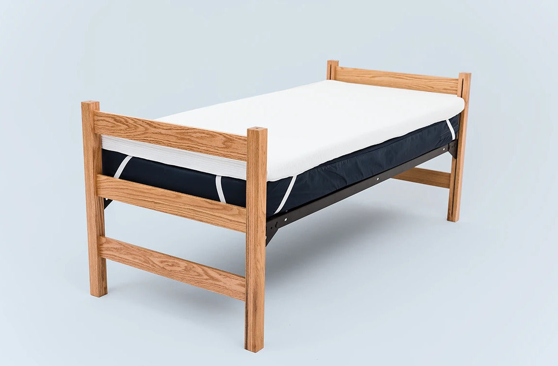 A Molecule mattress topper on college dorm bed