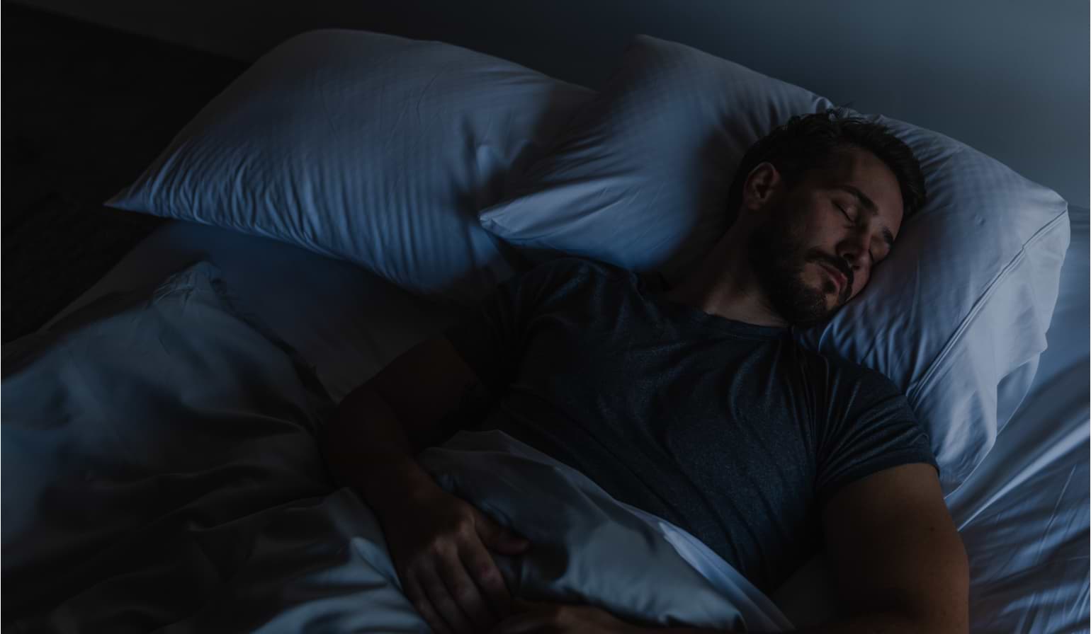 Man sleeping with lifted head using adjustable bed